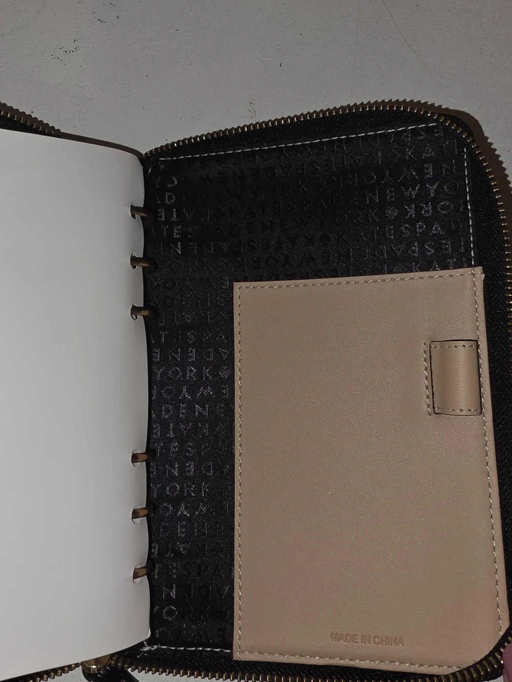 black pebbled leather Kate Spade Wellesley zip-around personal organizer